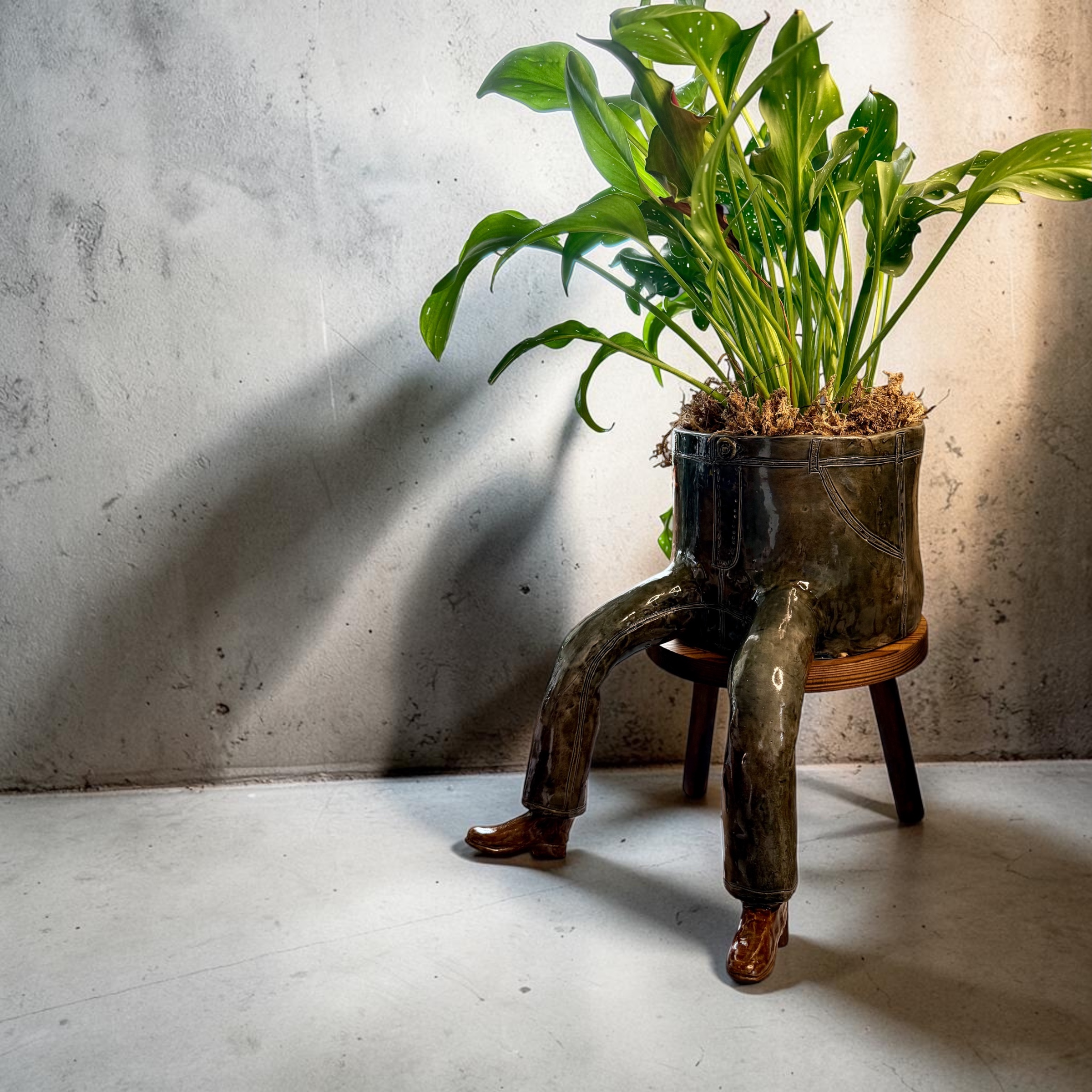 Casual Friday, a seated figure in jeans
